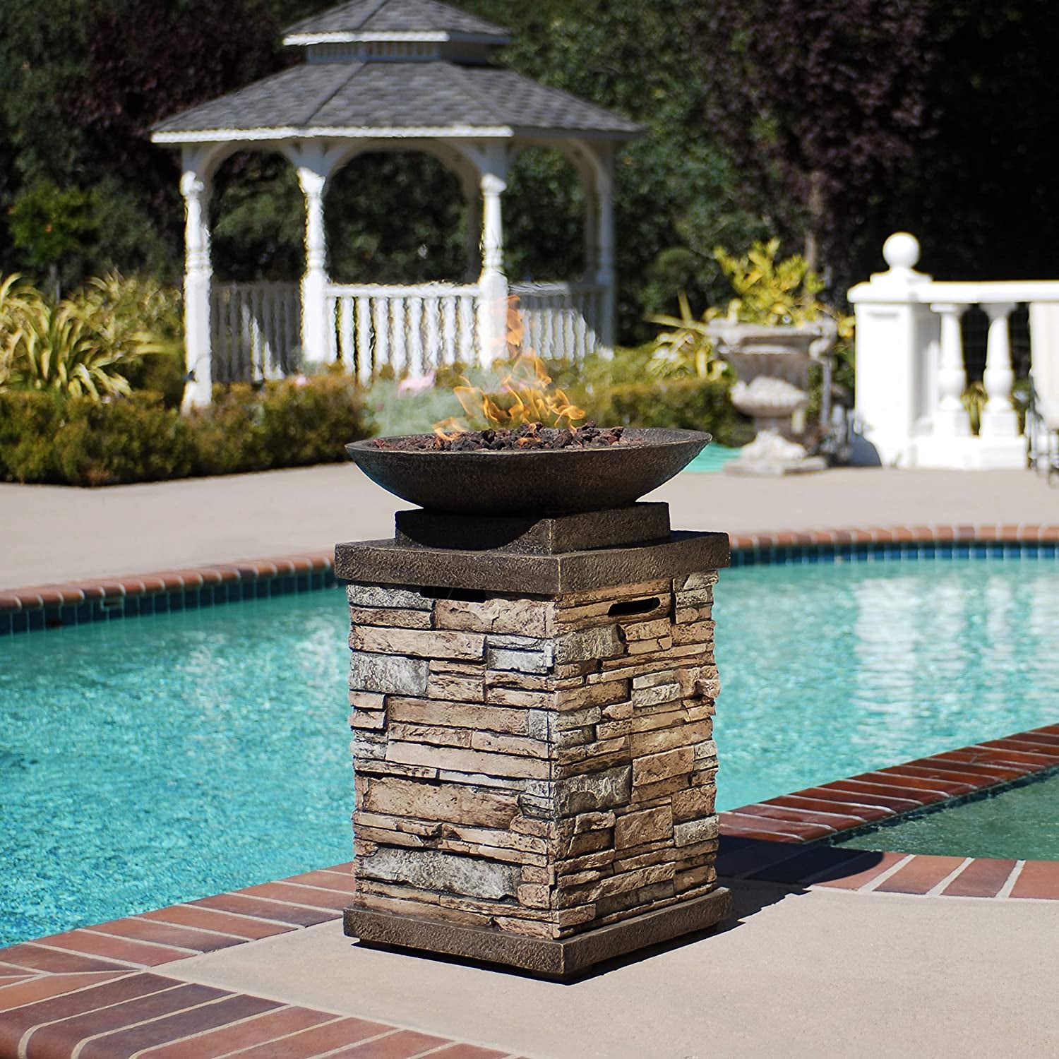 "Create a Cozy and Elegant Outdoor Ambiance with the Newcastle Propane Firebowl Column - Realistic Look Firepit Heater with Lava Rock, 40,000 BTU - Perfect for Outdoor Gatherings - Natural Stone Design - Pack of 1"