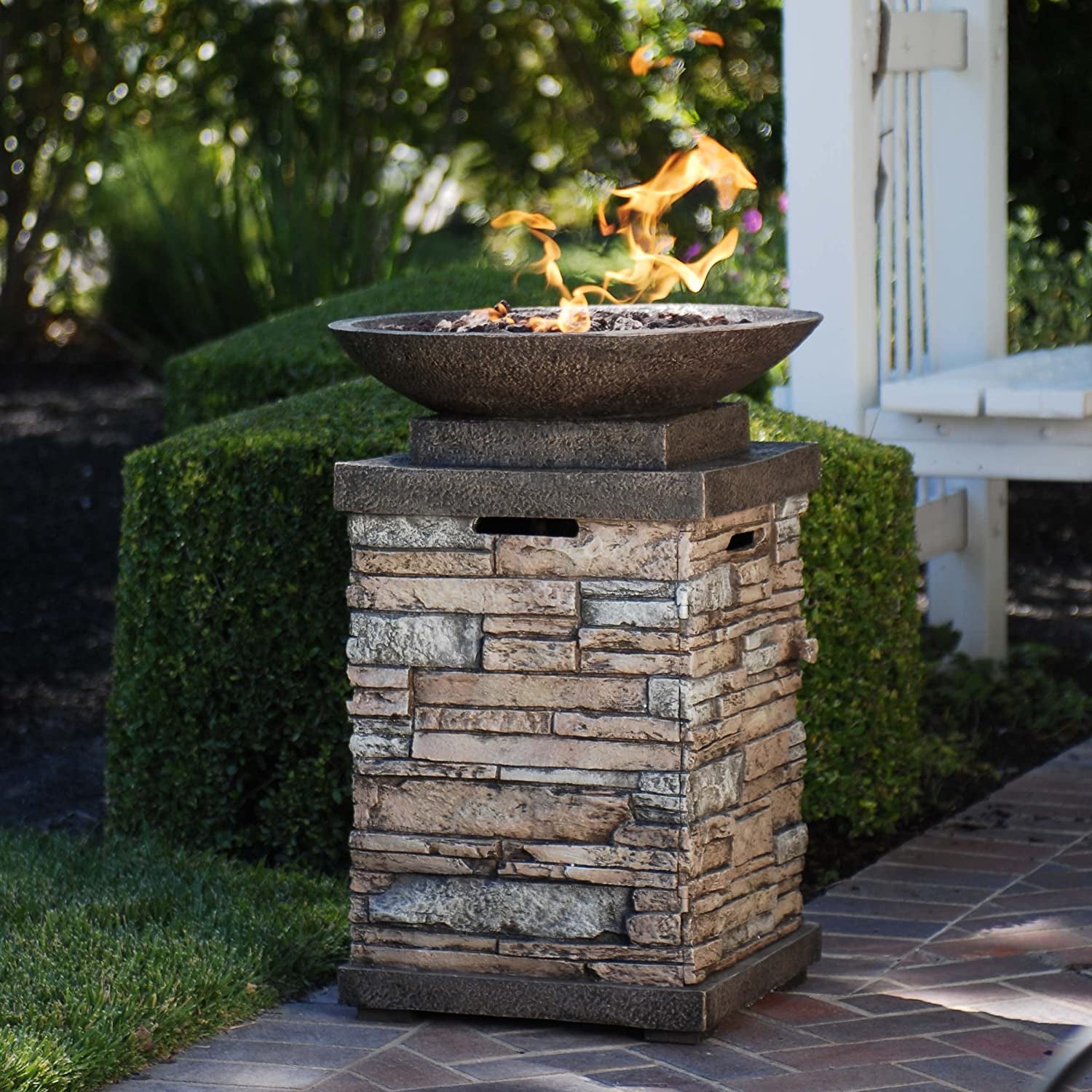 "Create a Cozy and Elegant Outdoor Ambiance with the Newcastle Propane Firebowl Column - Realistic Look Firepit Heater with Lava Rock, 40,000 BTU - Perfect for Outdoor Gatherings - Natural Stone Design - Pack of 1"